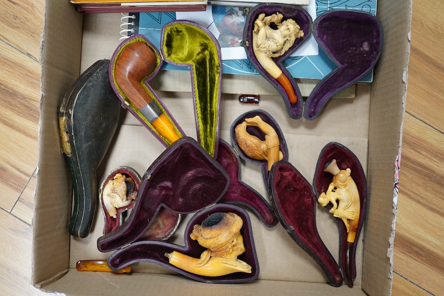 Six cased Meerschaum pipes and a cased amber and silver mounted pipe unused, together with smoking related books, longest pipe 17cm. Condition - most meerschaum pipes used therefore stained and smoking ends broken